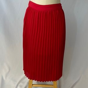 Red pleated skirt